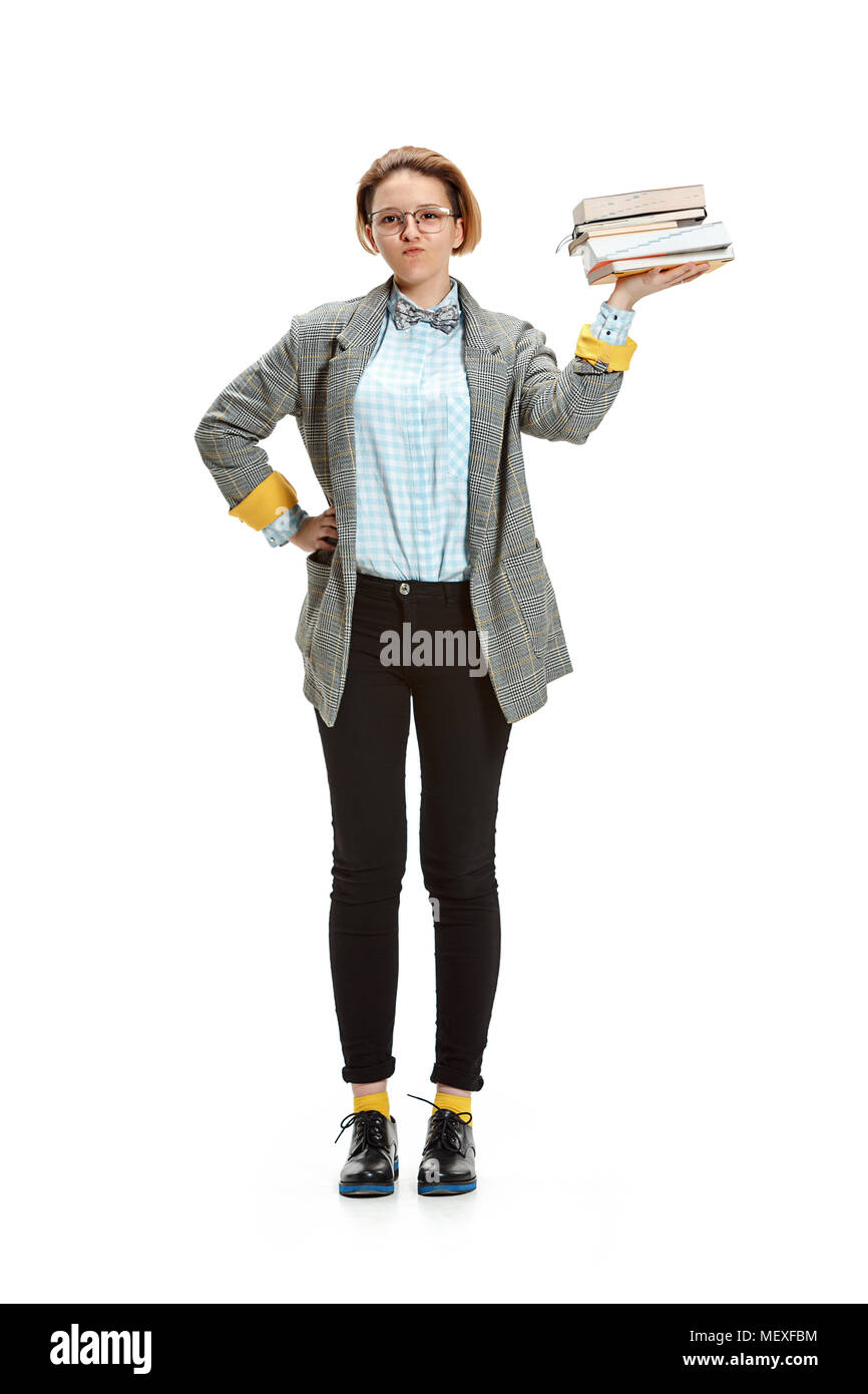 Full length portrait of a happy smiling female student holding books ...