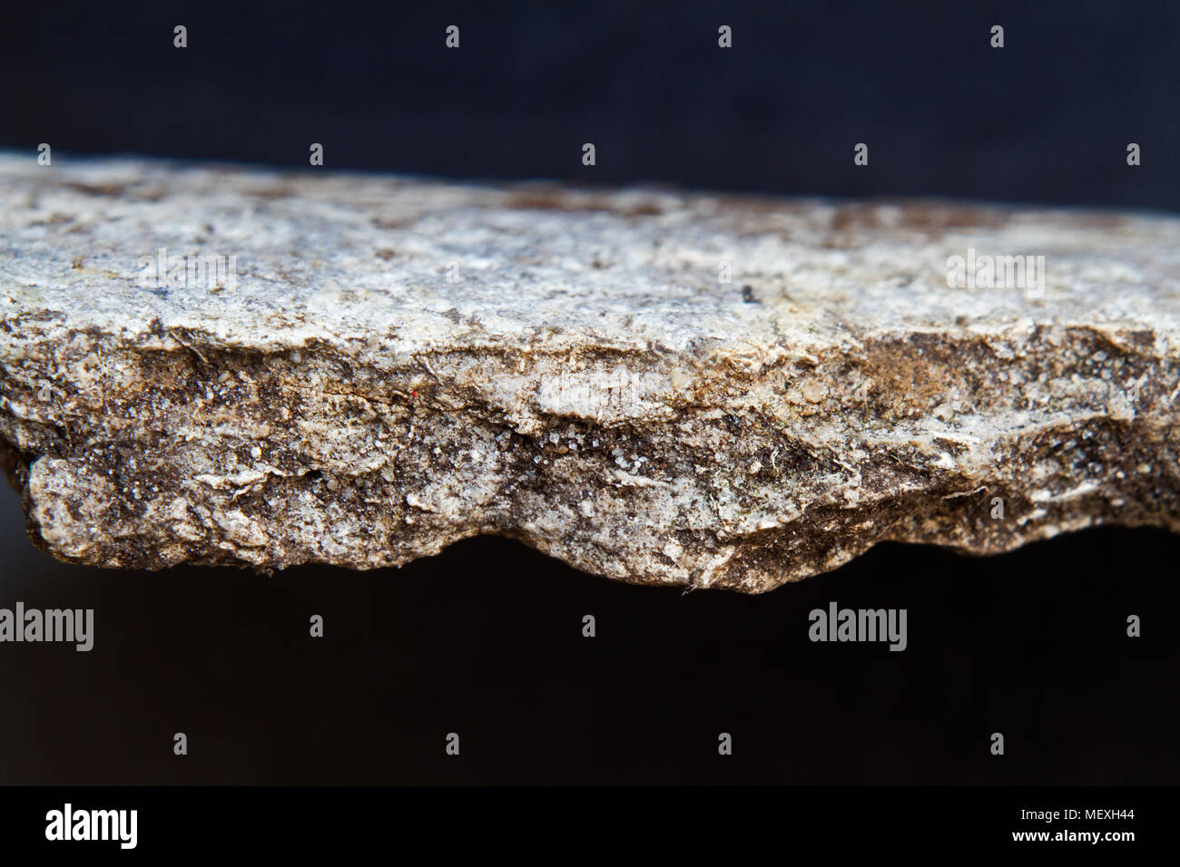 Small piece of an asbestos cement corrugated roofing sheet Stock Photo