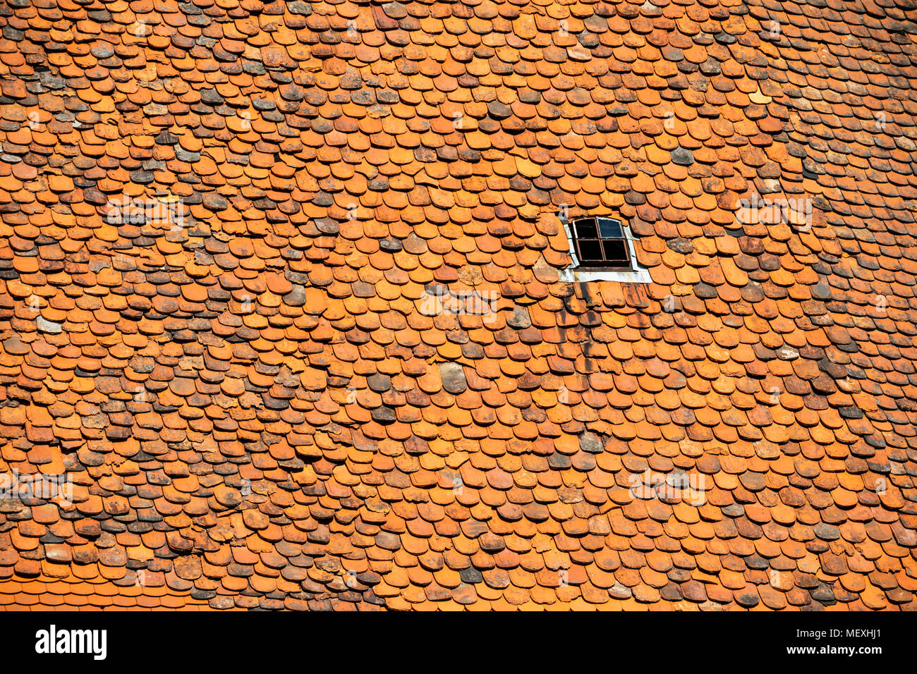 housetop with historic beaver-tail roofing tiles in Büdingen, Hesse, Germany, Europe Stock Photo