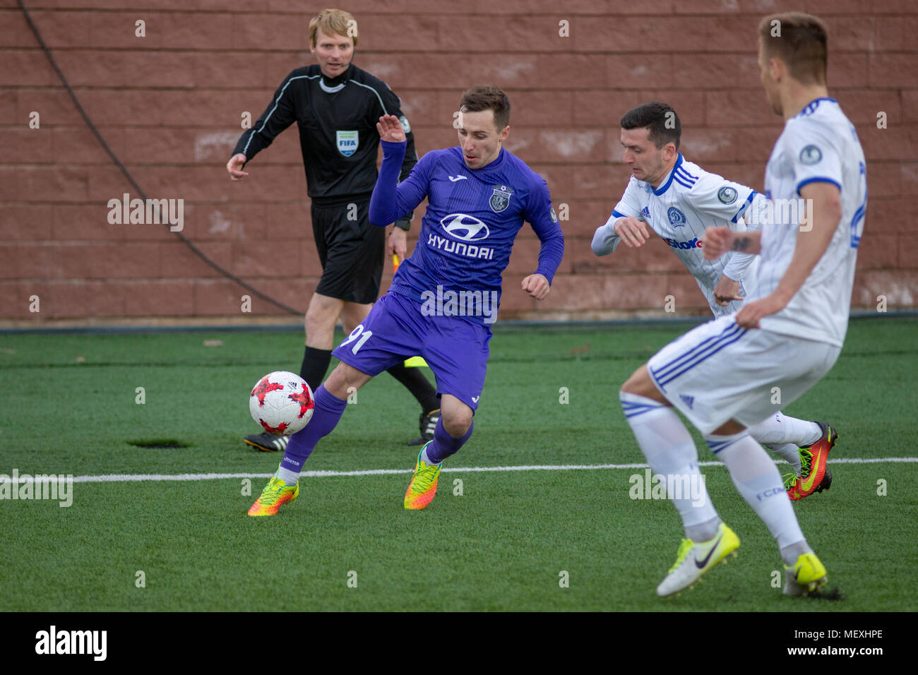 MINSK, BELARUS - APRIL 7, 2018: Soccer players during the Belarusian Premier League football match between FC Dynamo Minsk and FC Isloch at the FC Minsk Stadium. Stock Photo