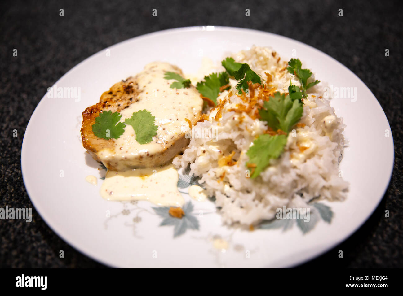 Pork medallion with white jasmine rice, served with fried onion and