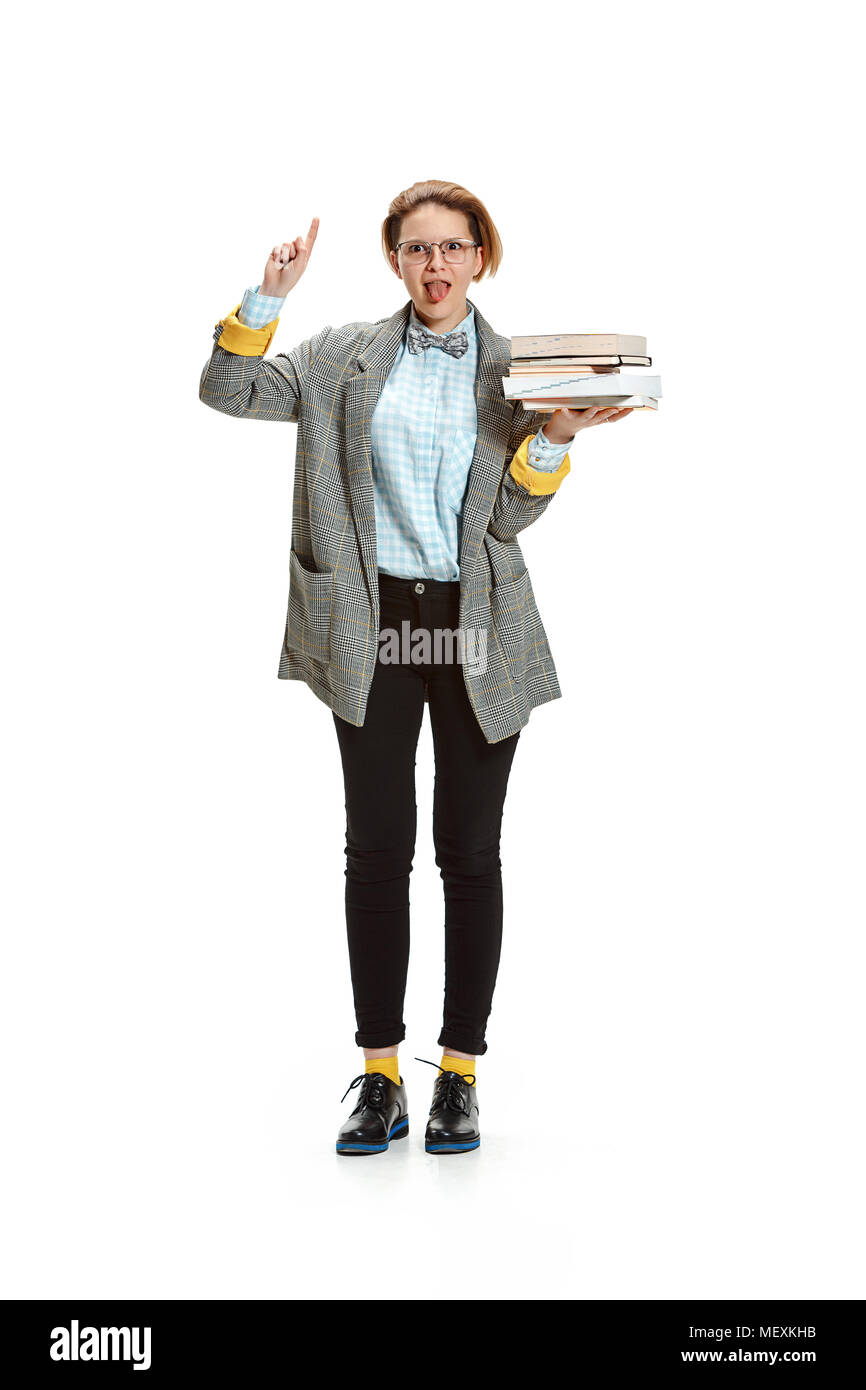 Full length portrait of a happy smiling female student holding books ...