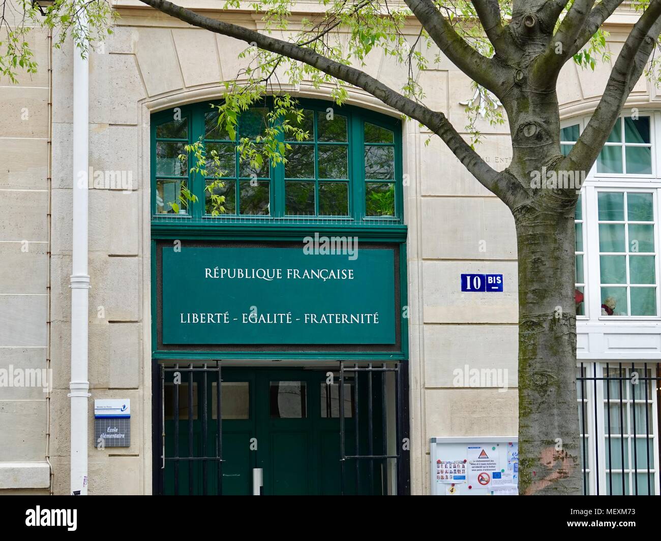 Front entrance to an elementary school with the words “République ...