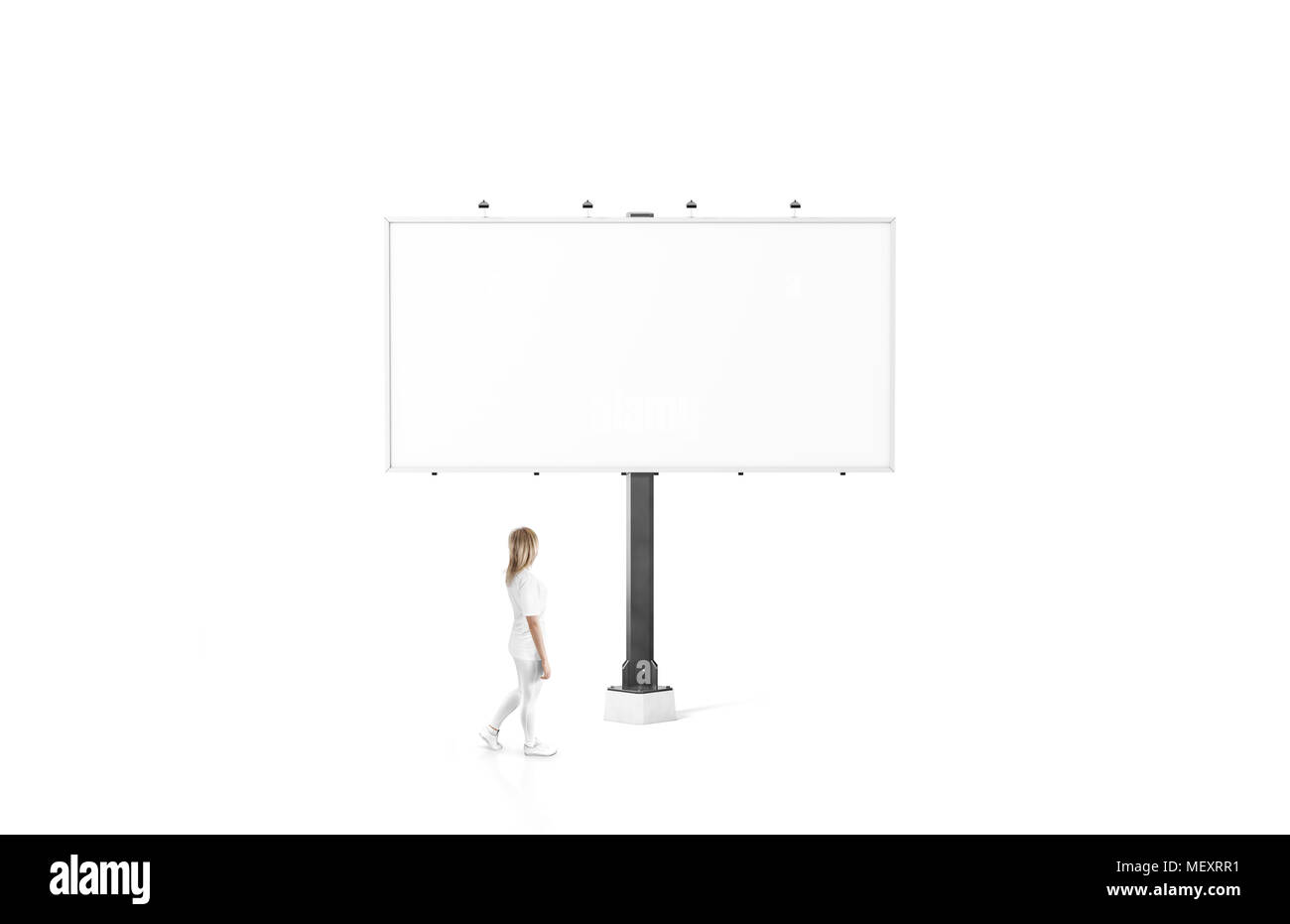 Woman stand near blank white city billboard mock up. Empty bill board mockup isolated. Clear bilboard canvas template on street sign. Outdoor poster s Stock Photo