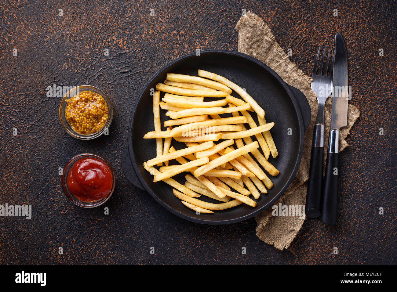 French fries with tomato sauce and mustard Stock Photo Alamy