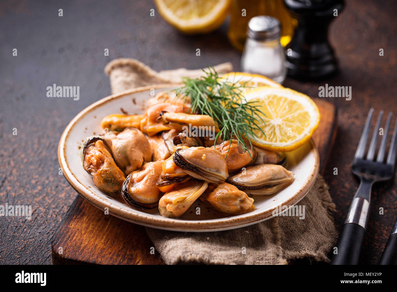 Marinated mussels with lemon and spices Stock Photo - Alamy