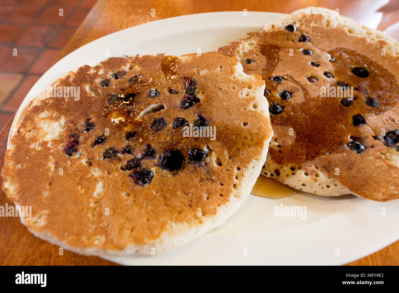 Blueberry pancakes with maple syrup for a traditional american breakfast , Texas USA Stock Photo