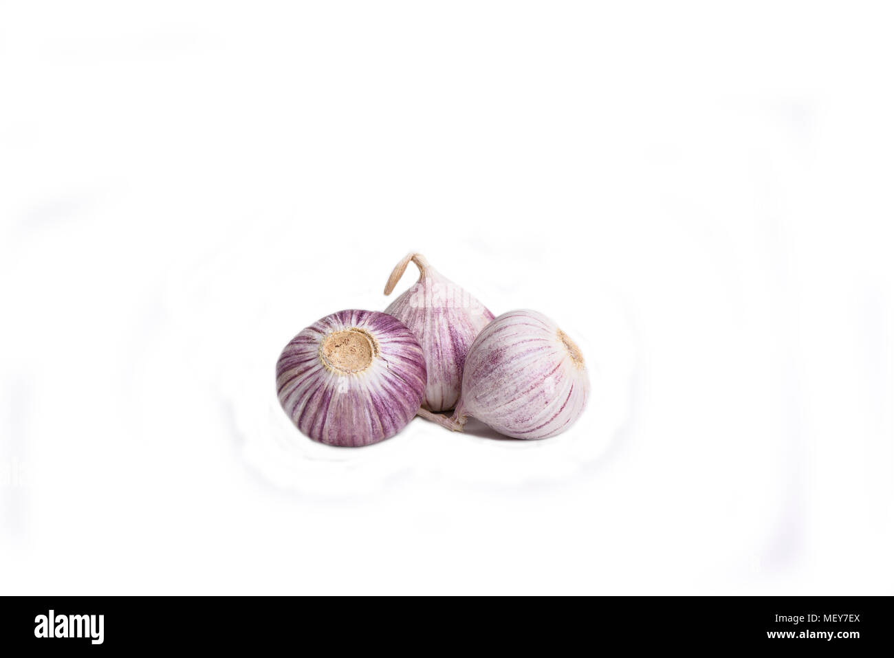 Three garlic bulbs isolated on white background Stock Photo
