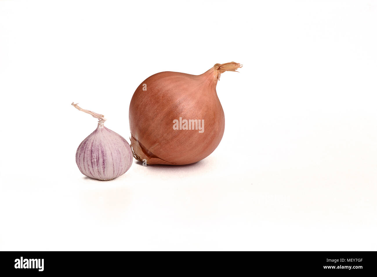 Onion and garlic bulbs isolated on white background Stock Photo Alamy