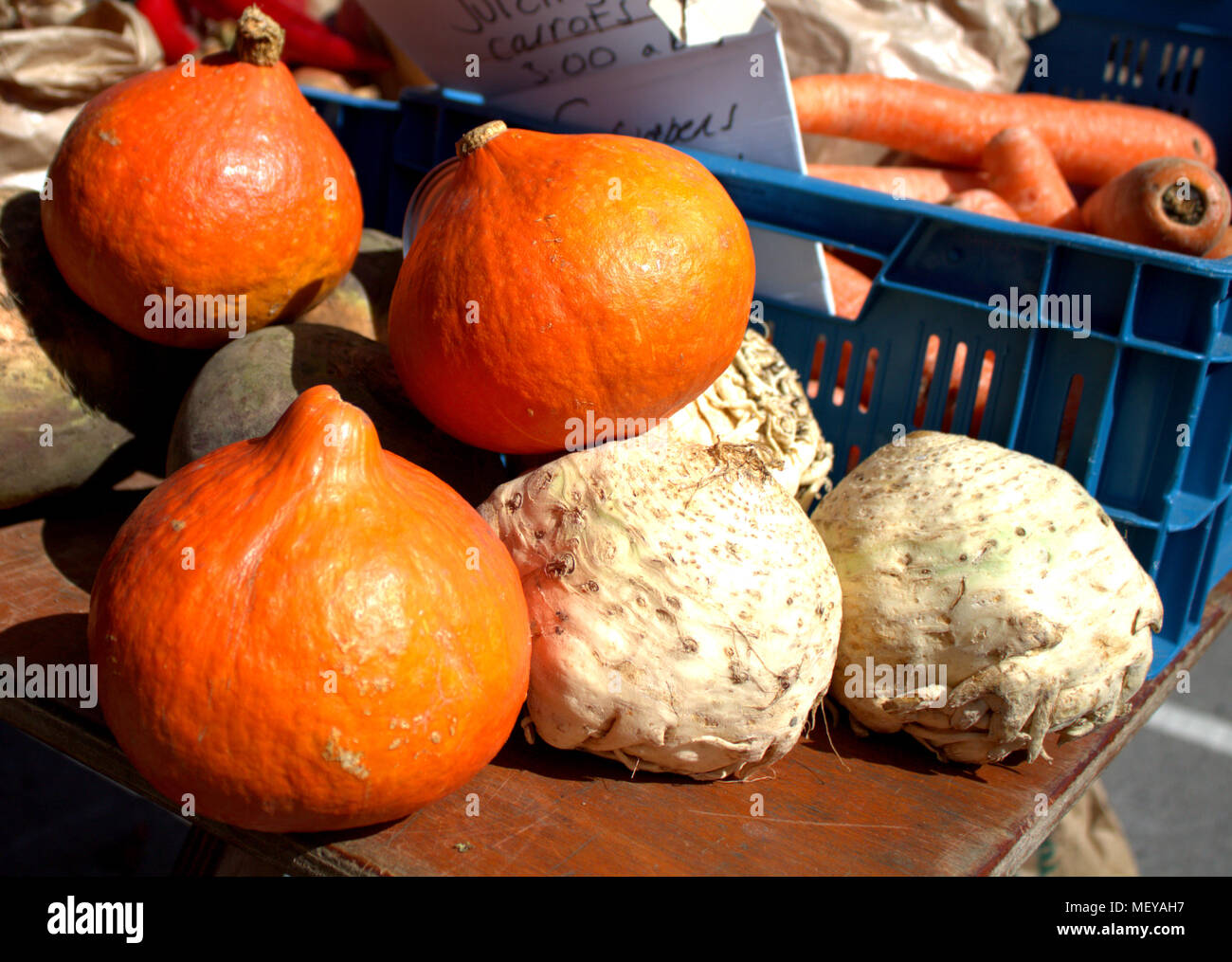 squashes and celeriac, part of a fresh vegetable display on sale at a weekly food market or farmers market. Skibbereen, ireland a popular market place. Stock Photo