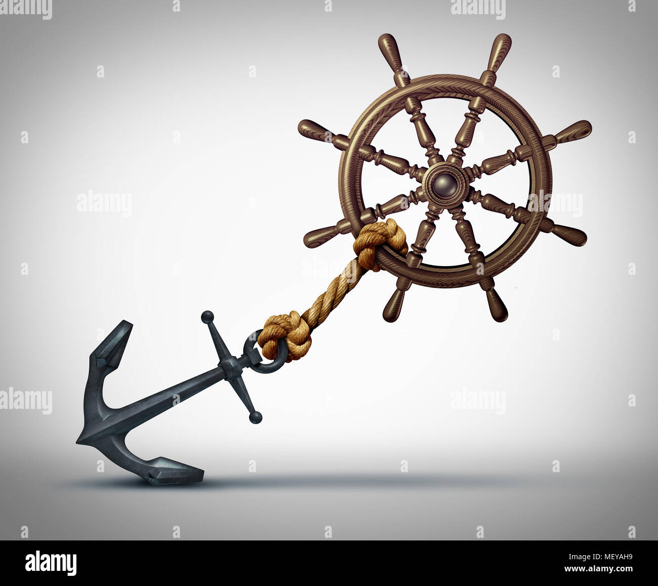 Business direction struggle and success effort to steer and navigate towards success as a ship wheel held back by an anchor. Stock Photo