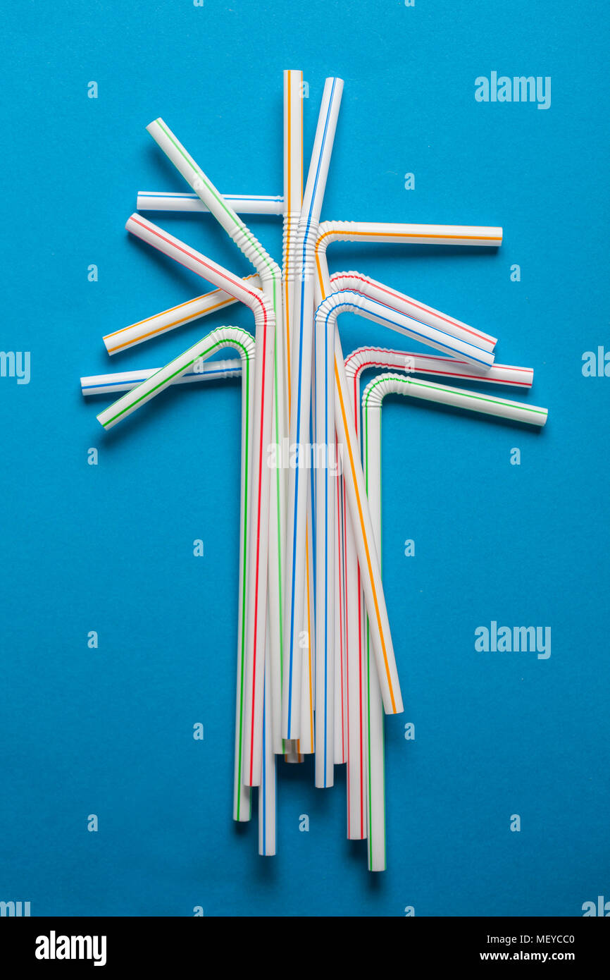 Plastic straws on a blue background Stock Photo Alamy
