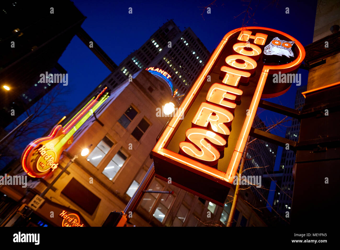 Atlanta capital of the U.S. state of Georgia, Exterior of Hooters bar neon sign outside their Downtown Peachtree restaurant at night Stock Photo