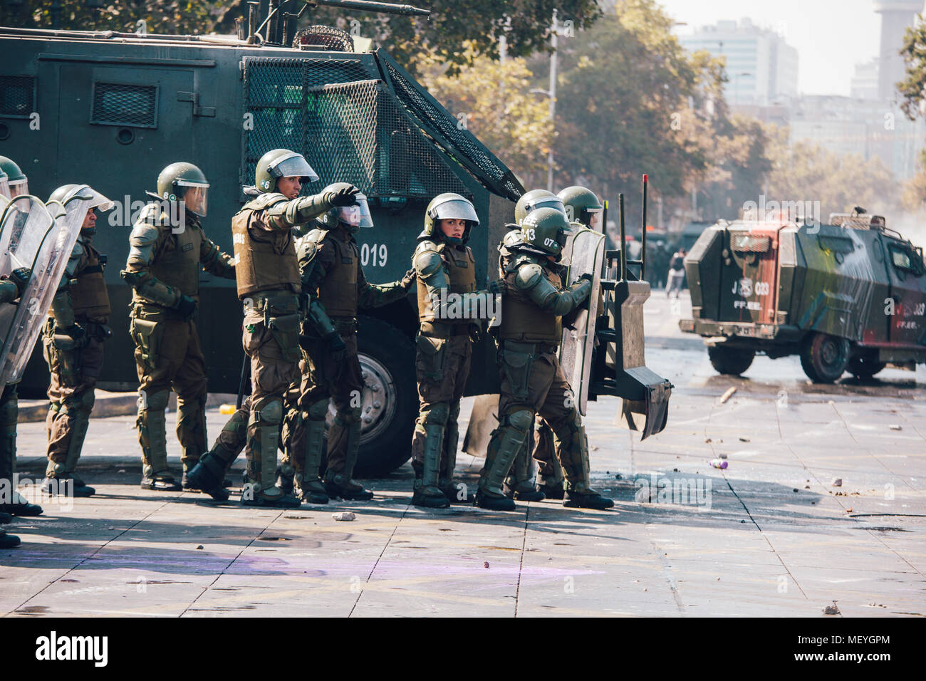 Santiago, Chile - April 19, 2018: Chilean riot Police disperse protesters during a demonstration demanding an end to the Profit in the Education. Stock Photo
