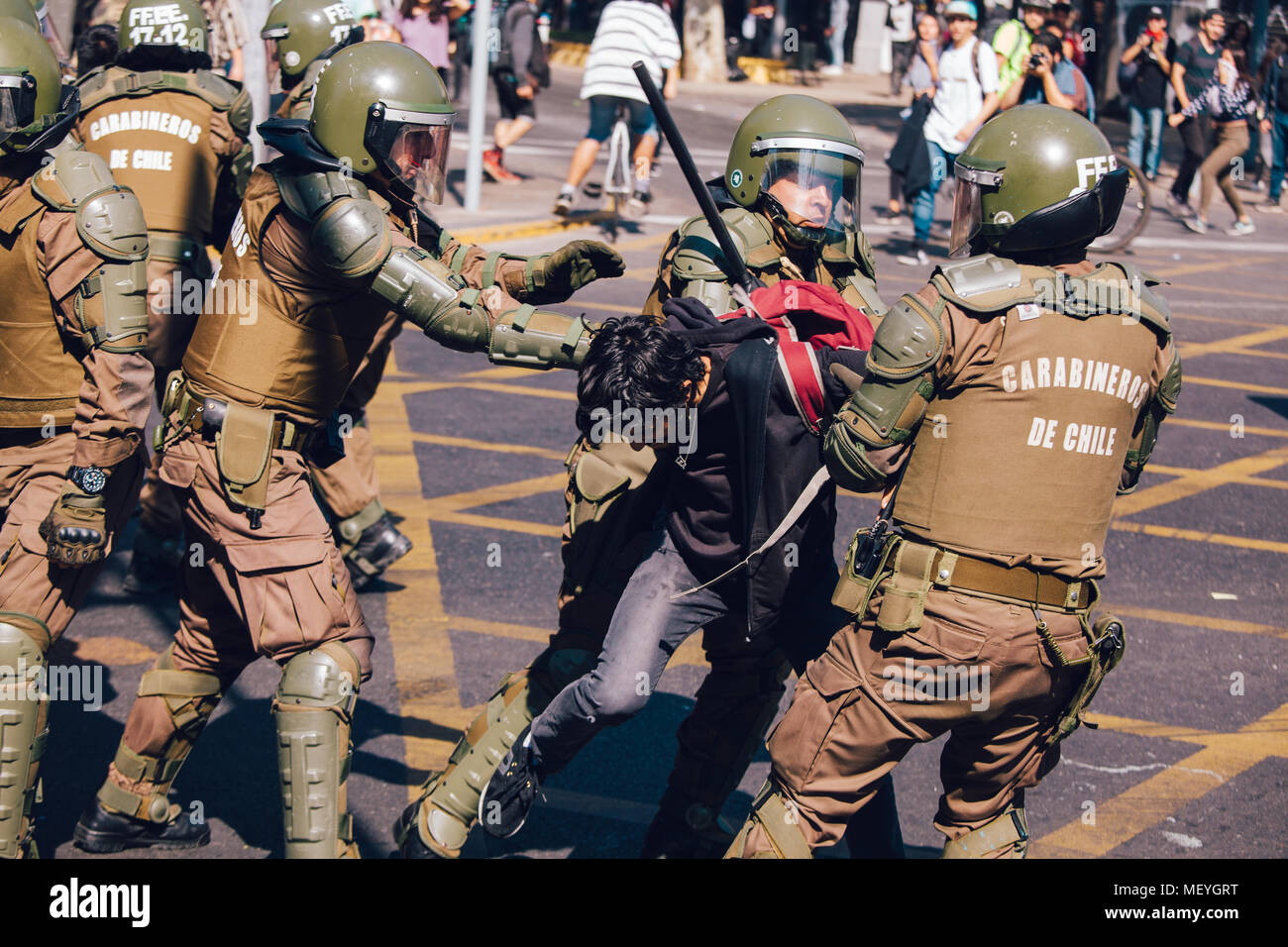 Santiago, Chile - April 19, 2018: Protester arrested by the chilean riot police during a demonstration demanding an end to the Profit in the Education Stock Photo