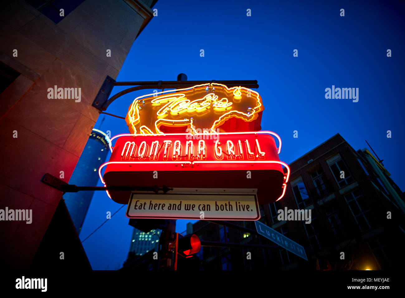 Atlanta capital of the U.S. state of Georgia, Downtown TEDS Montana Grill restaurant neon light sign chain specialising in bison at night Stock Photo