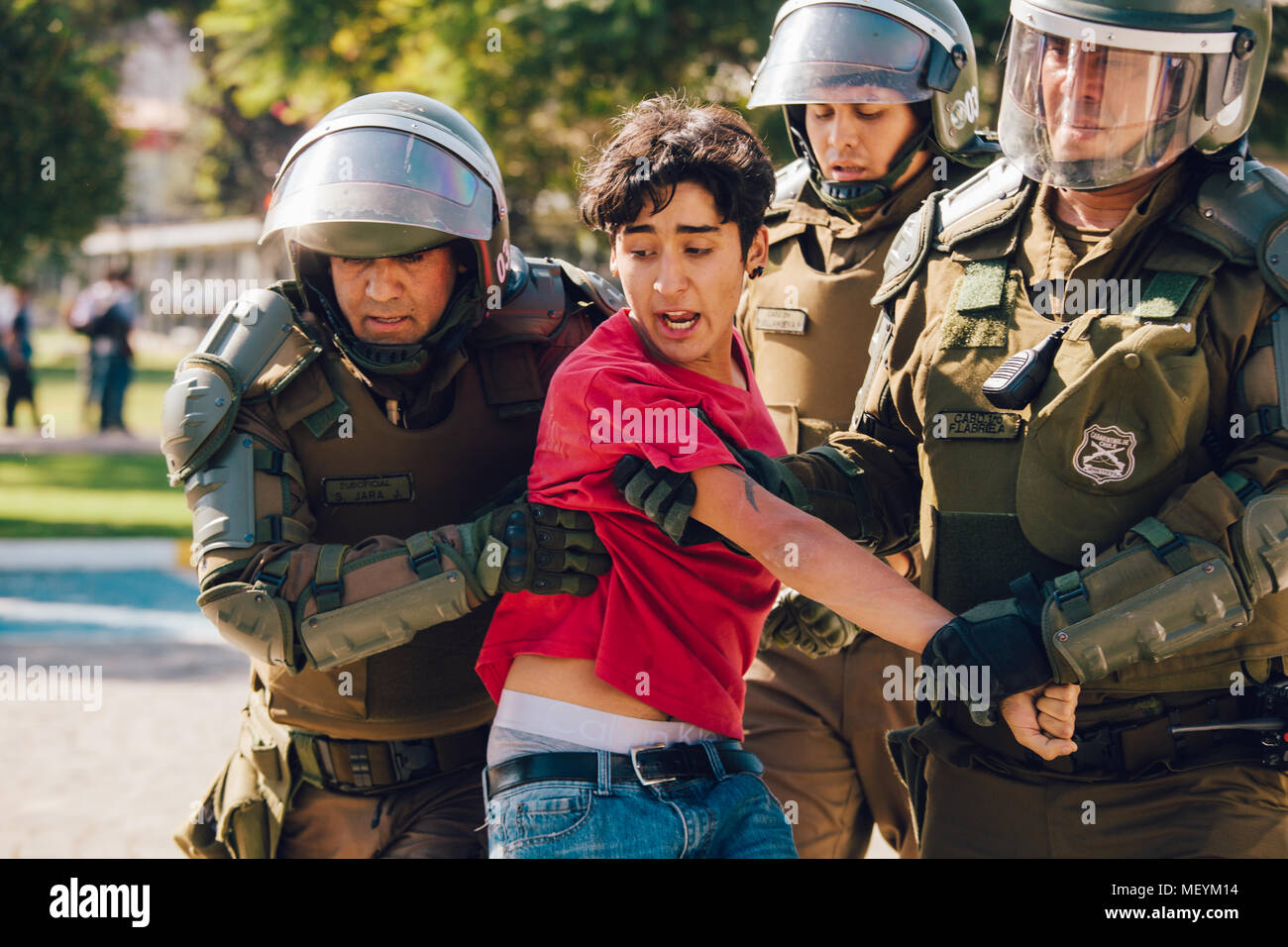 Santiago, Chile - April 19, 2018: Protester arrested in the University of Santiago during a demonstration demanding an end to the Profit in the Educat Stock Photo