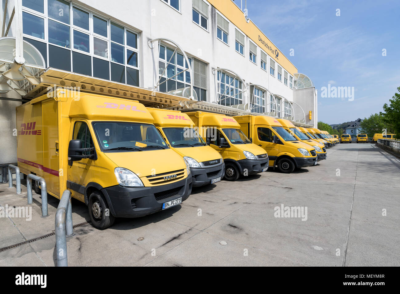 DHL delivery vans at depot. DHL is a division of the German logistics