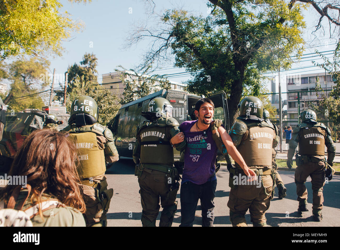 Santiago, Chile - April 19, 2018: Protester arrested in the University of Santiago during a demonstration demanding an end to the Profit in the Educat Stock Photo