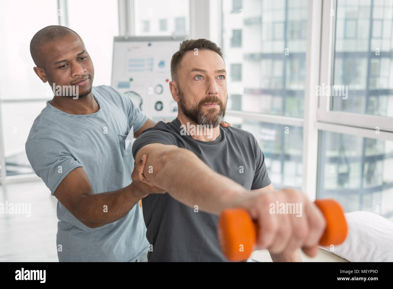 Nice adult man doing a physical exercise Stock Photo