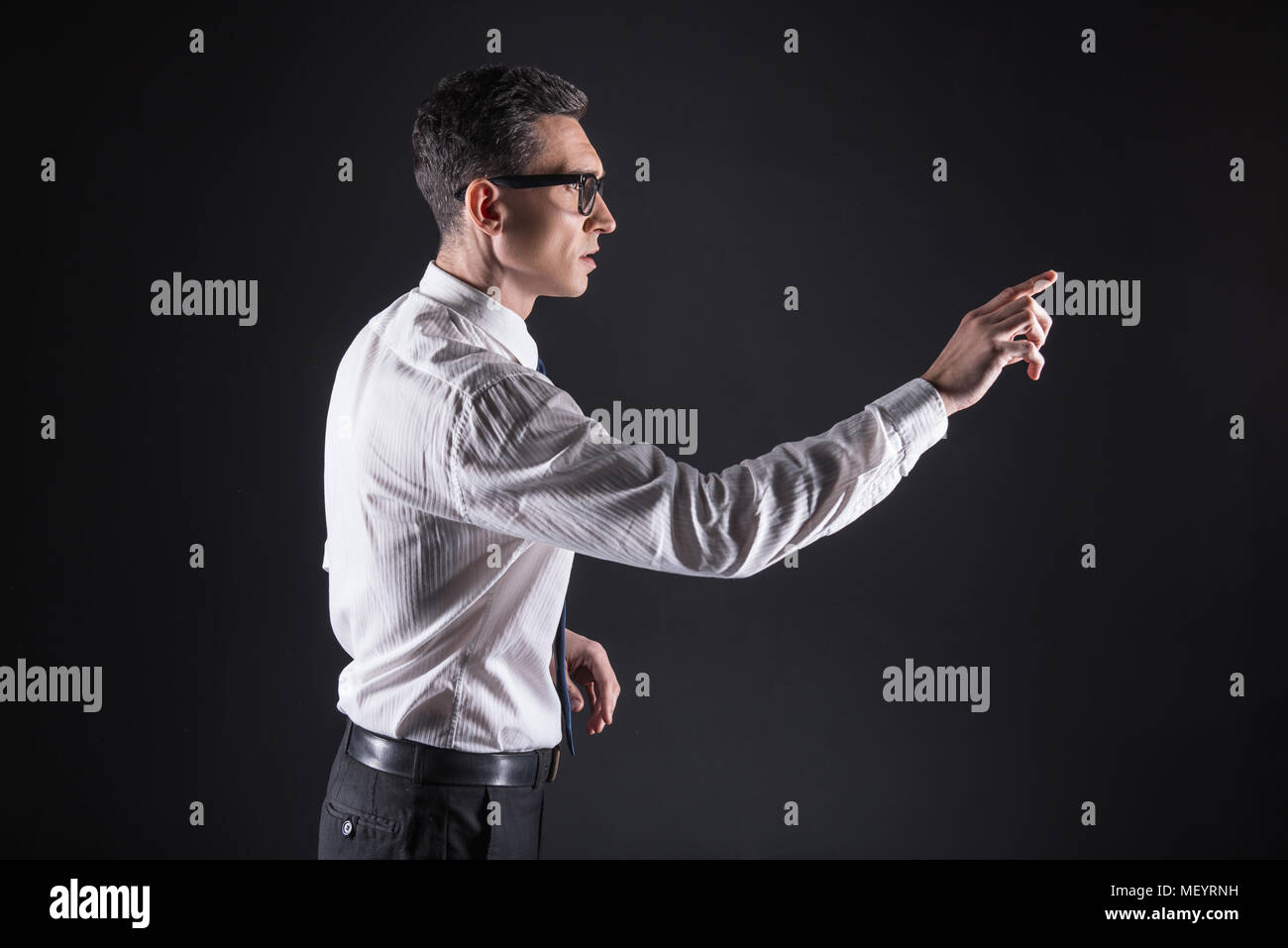 Smart handsome man working with electronics Stock Photo - Alamy