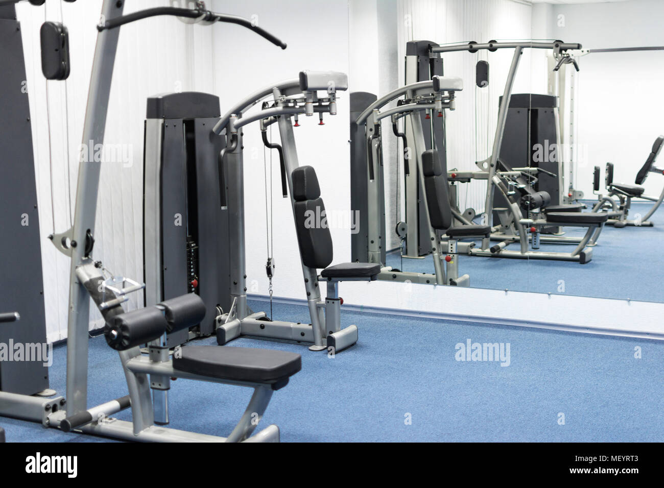 Home gym with big mirror Stock Photo - Alamy