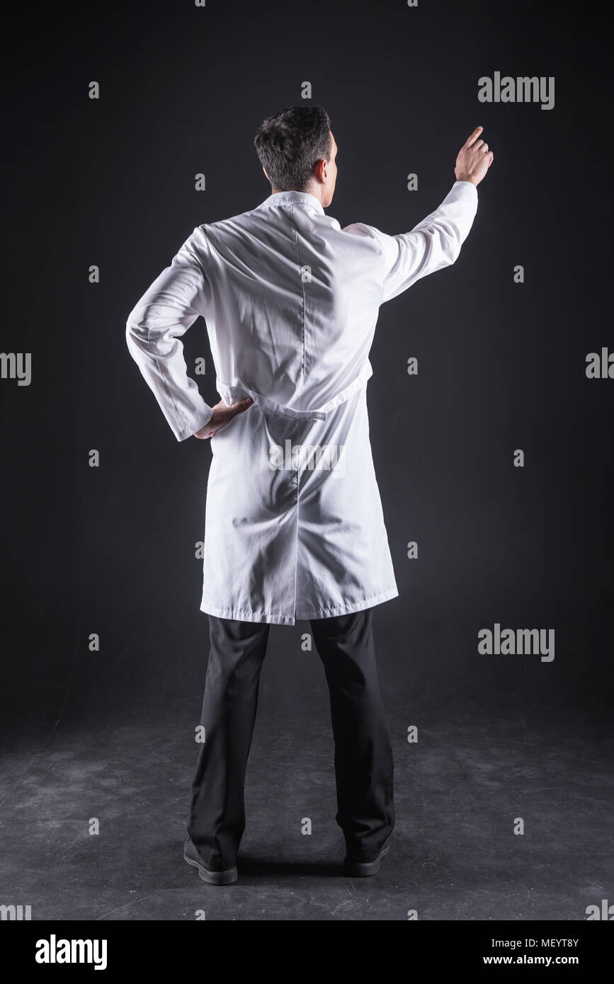 Pleasant nice man standing in front of the sensory panel Stock Photo