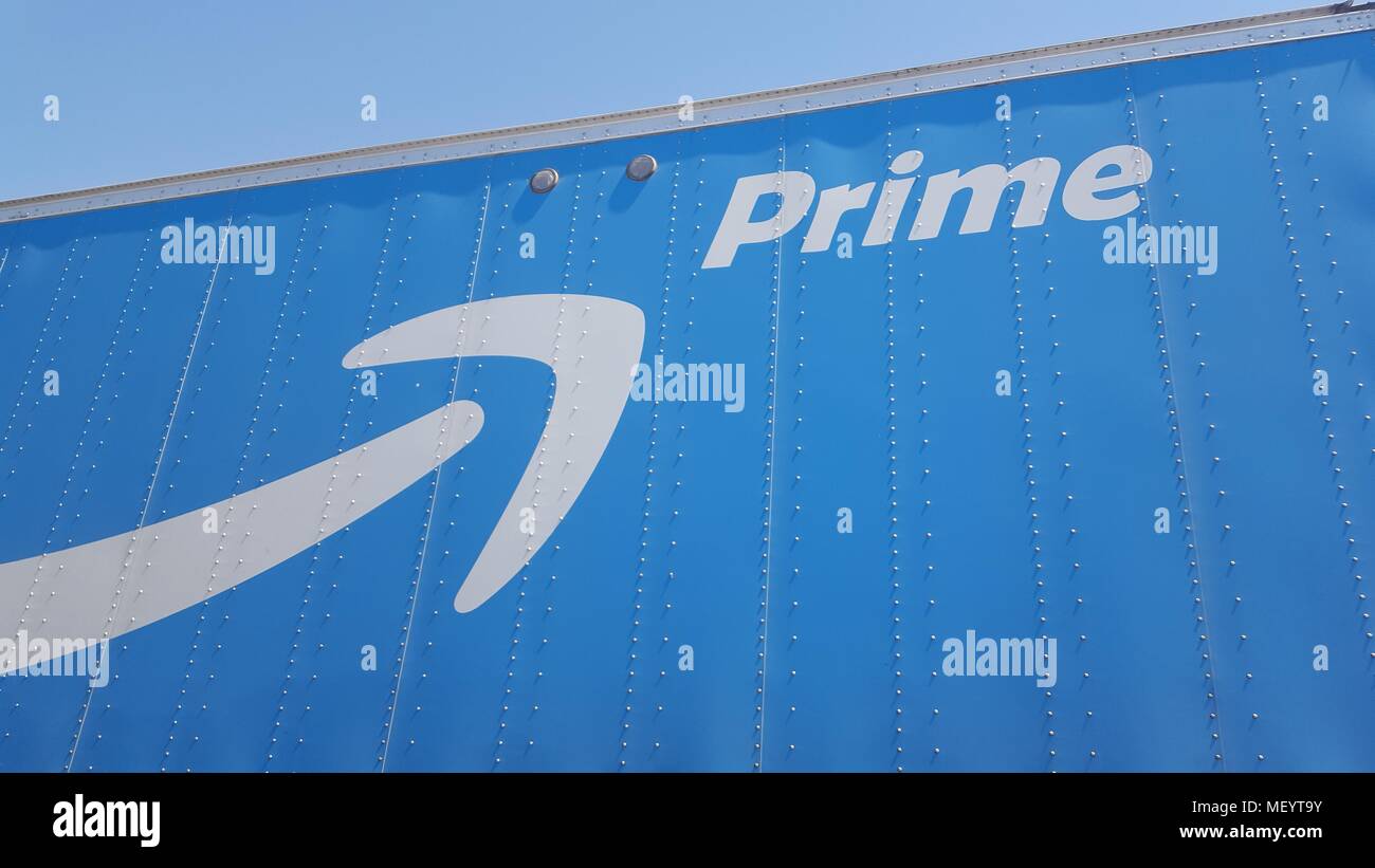 Logo for the Amazon Prime service on the side of a tractor trailer semi
