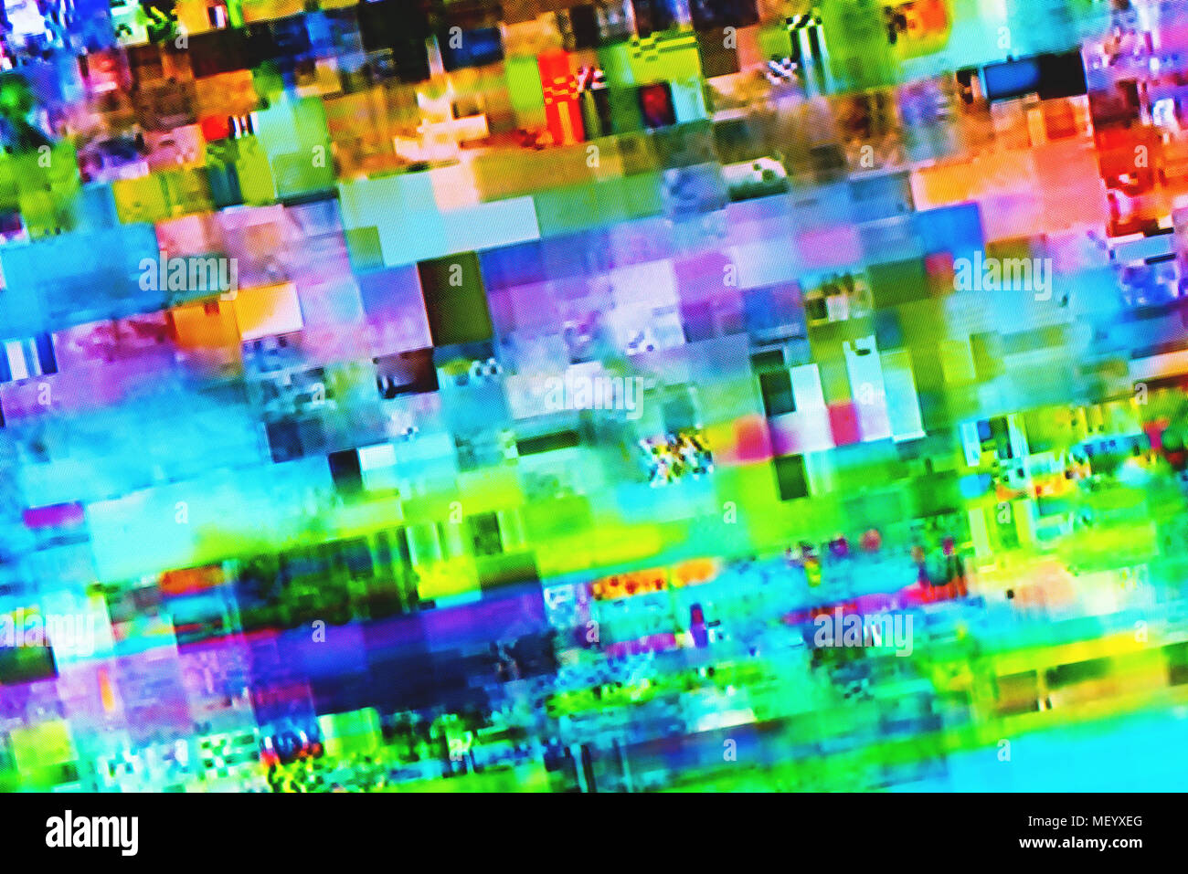 Digital TV glitch on television screen with misplaced squares, static effects and freezing problems during broadcast failure Stock Photo