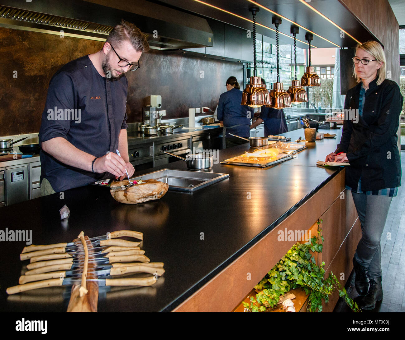 Heiko Lacher's team is easily manageable, because the star chef and his two cooks work behind a long open kitchen that flanks the entire dining room. Miso Dish prepared by German Michelin Star Chef Heiko Lacher. Restaurant Anima in Tuttlingen, Germany Stock Photo