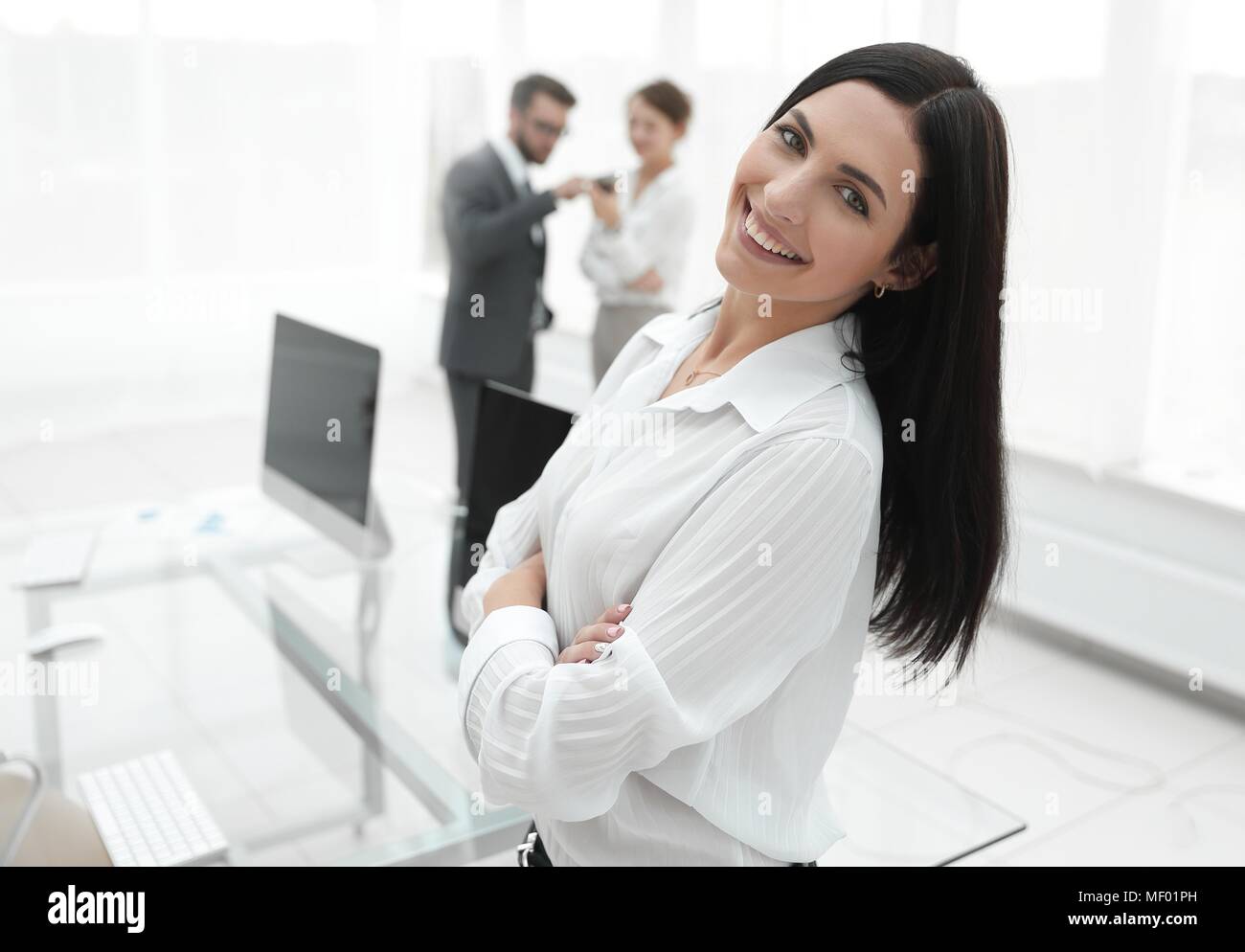 successful young business woman on the background of a workplace Stock ...