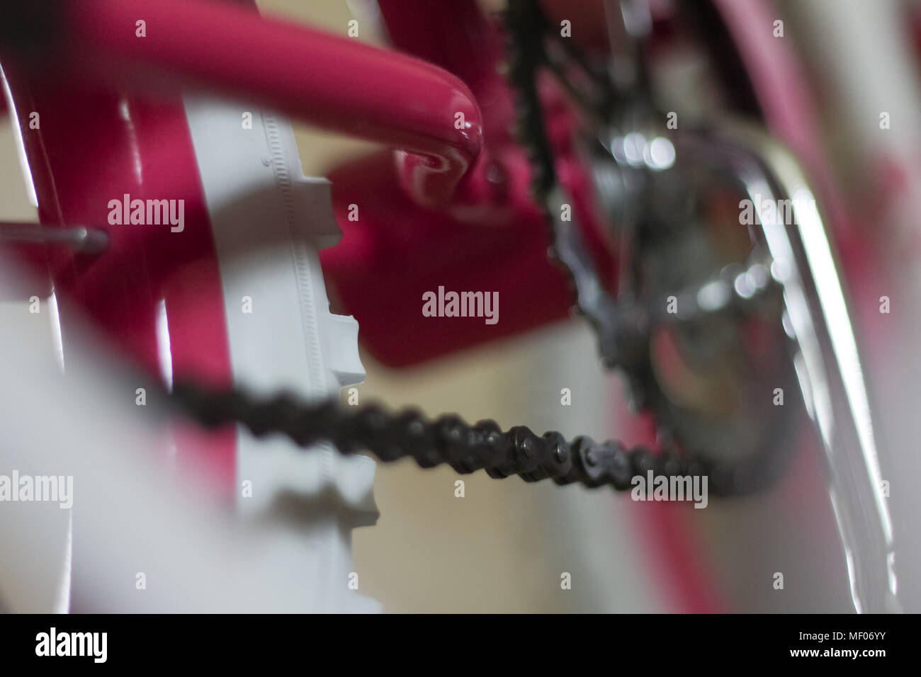 pink child's bicycle closeup with white wheels Stock Photo