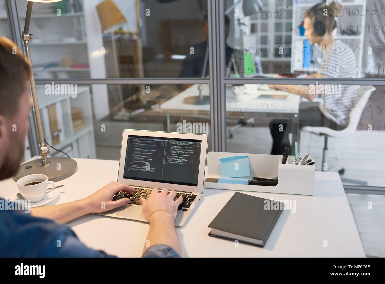 Coding on laptop Stock Photo