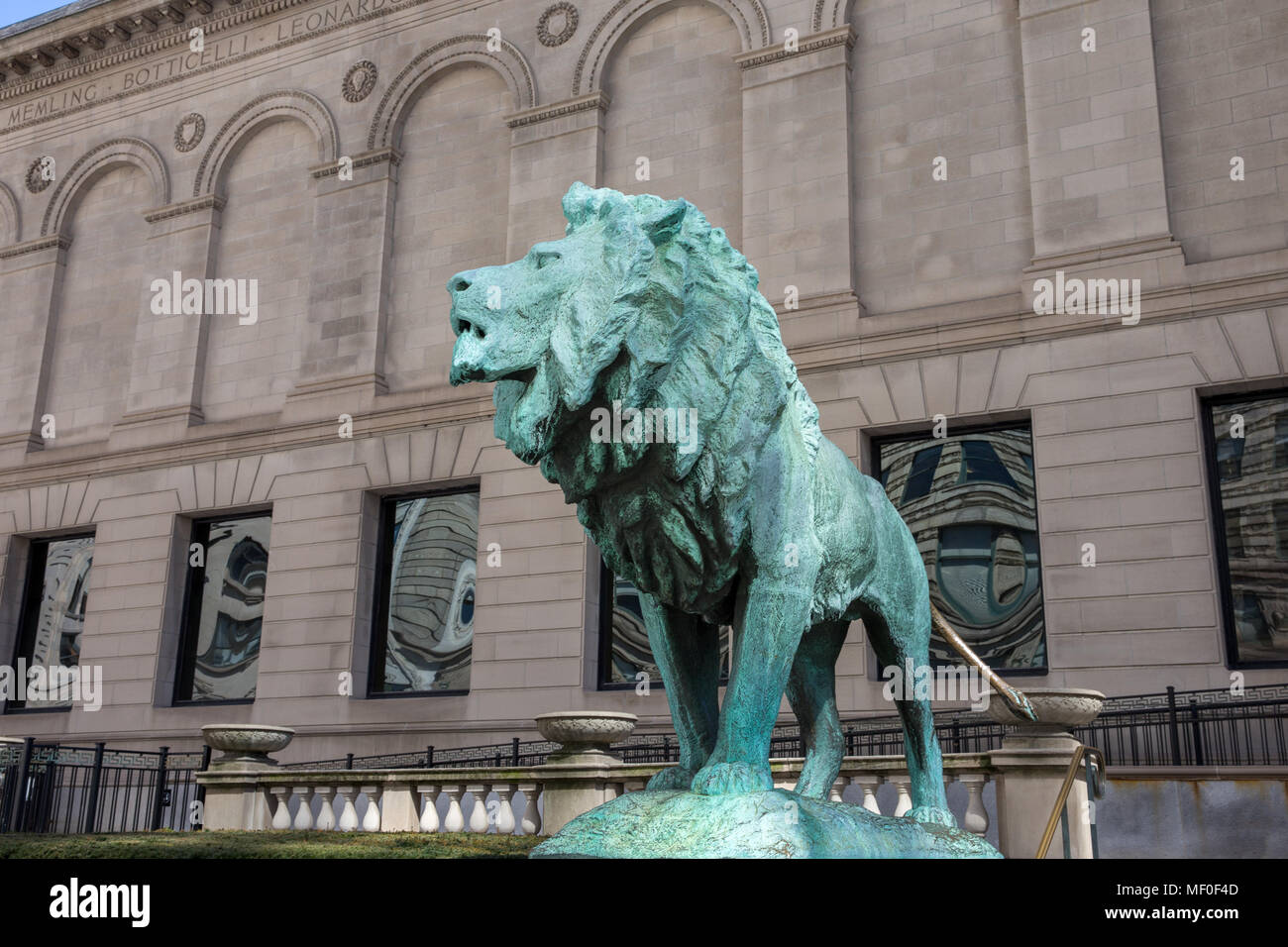 Chicago, USA - April 7, 2018:  Bronze lion statue standing guard at the Art Institute of Chicago.  There are two lion statues at the museum's Michigan Stock Photo