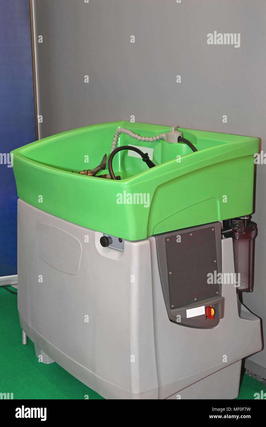 Parts Washer With Circulation Chemicals in Service Garage Stock Photo