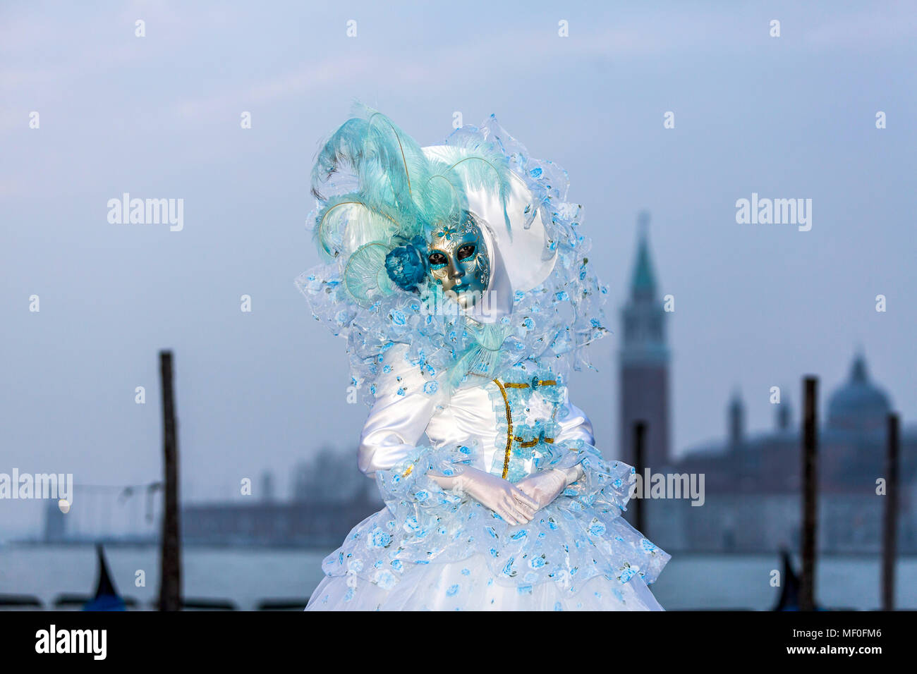 Historical carnival in Venice with masks and colorful costumes. Stock Photo