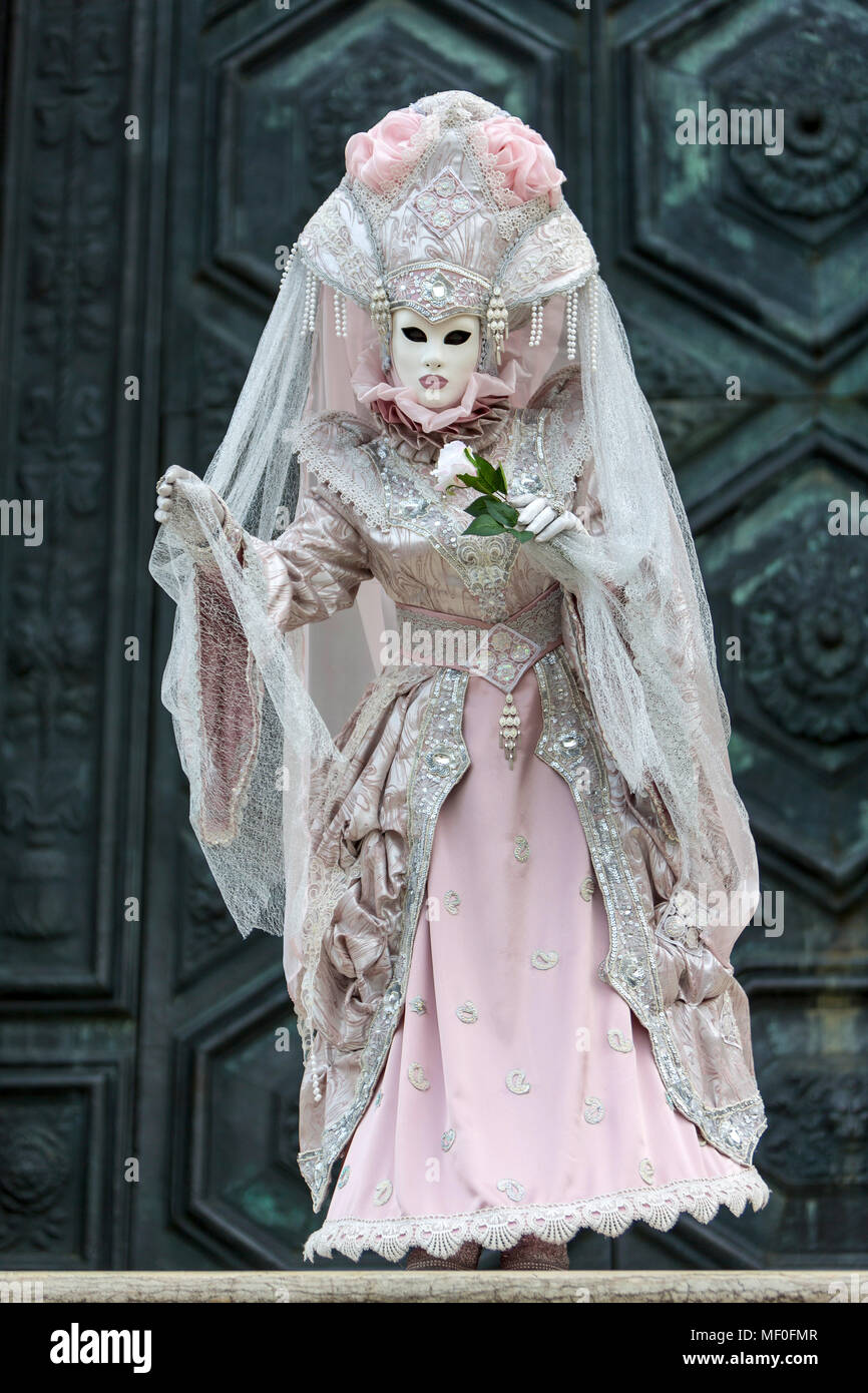 Historical carnival in Venice with masks and colorful costumes. Stock Photo