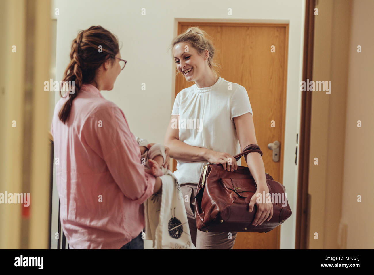 Greeting at door hi-res stock photography and images - Alamy