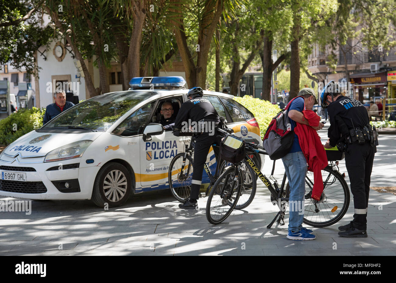 Palma, Majorca, Spain. 2018. Local police officers assist tourist in the centre of the city Stock Photo