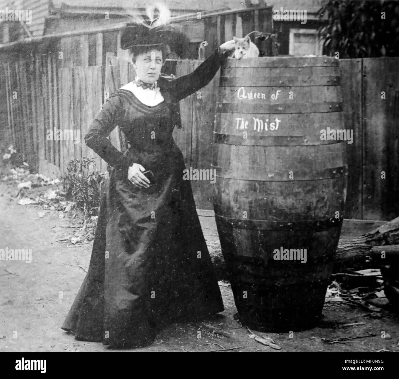 ANNIE EDSON TAYLOR (1838-1921) American schoolteacher who became the first person to survive going over the Niagara Falls in a barrel., a feat she accomplished on her birthday 24 October 1901. Note her cat. Photo: Bains News Service Stock Photo
