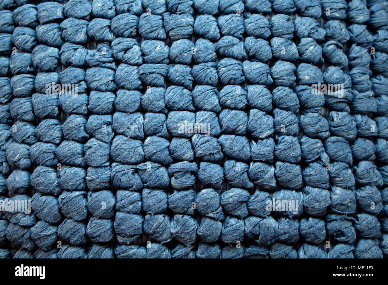 Close up view of blue knitted fabric background Stock Photo - Alamy