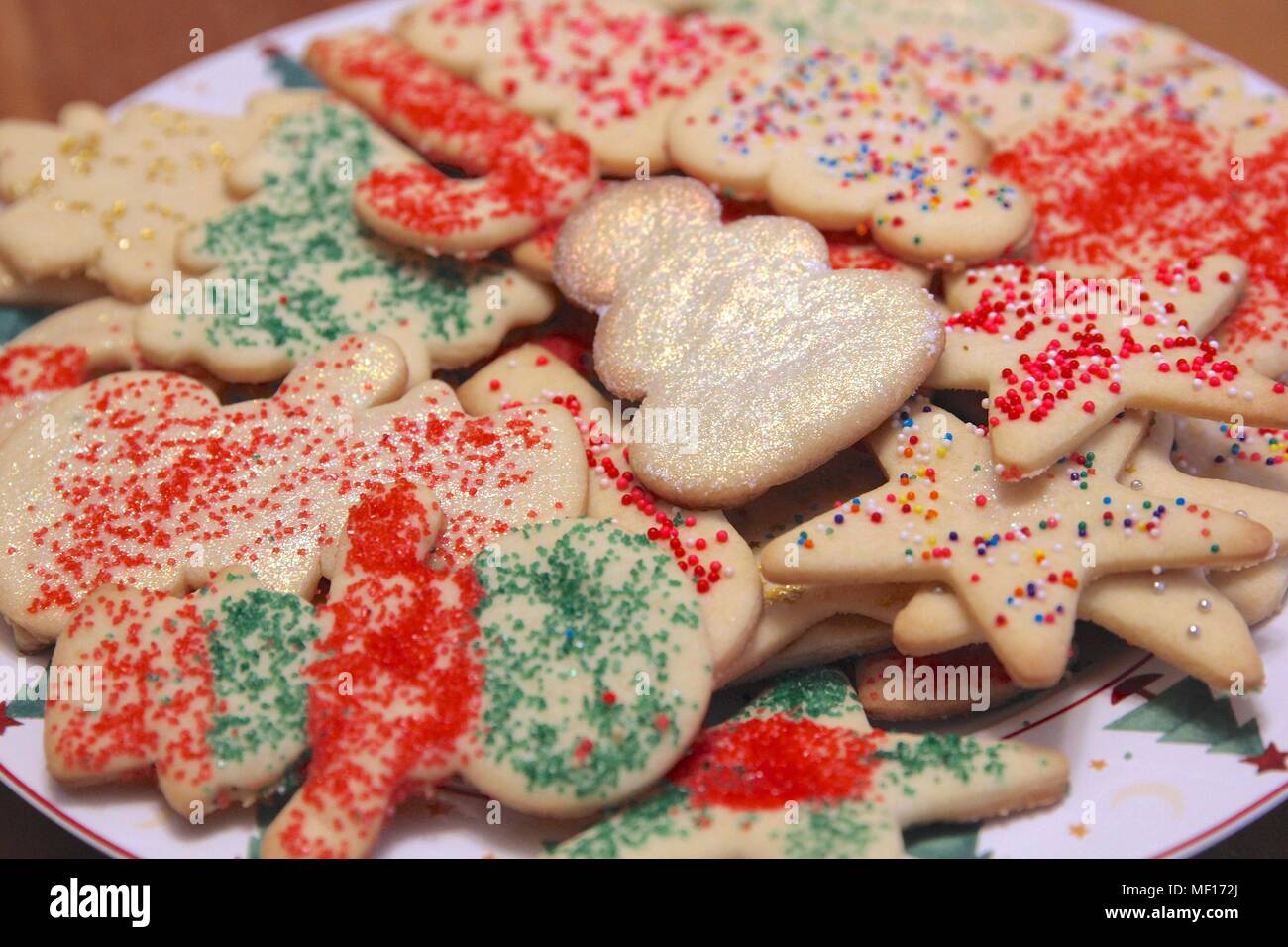 Plateful Of Christmas Cookies Decorated With Colorful Sprinkles And Glitter Stock Photo Alamy