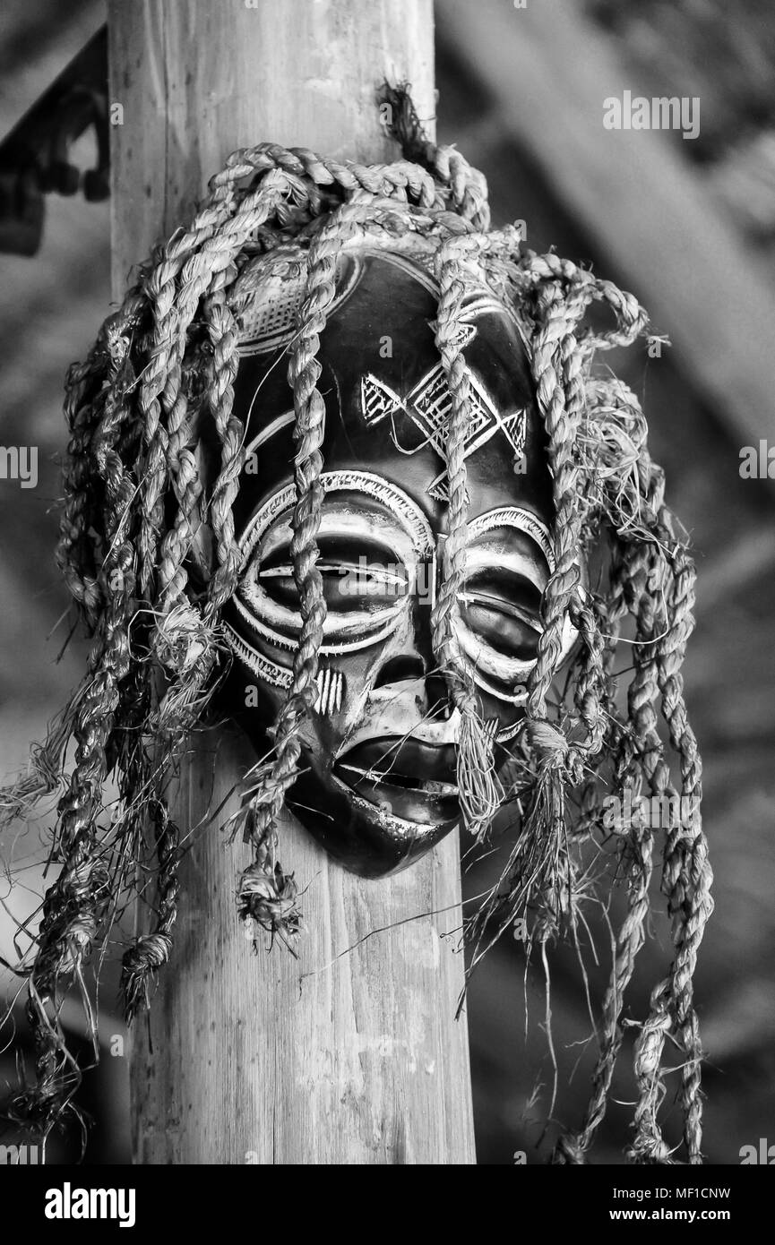 Black white image of tribal african wooden mask used in ceremonies such as weddings
