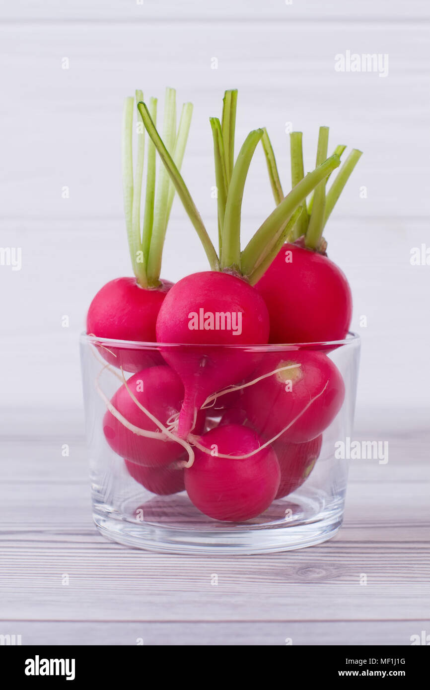 Ripe radishes in clear glass jar Stock Photo Alamy