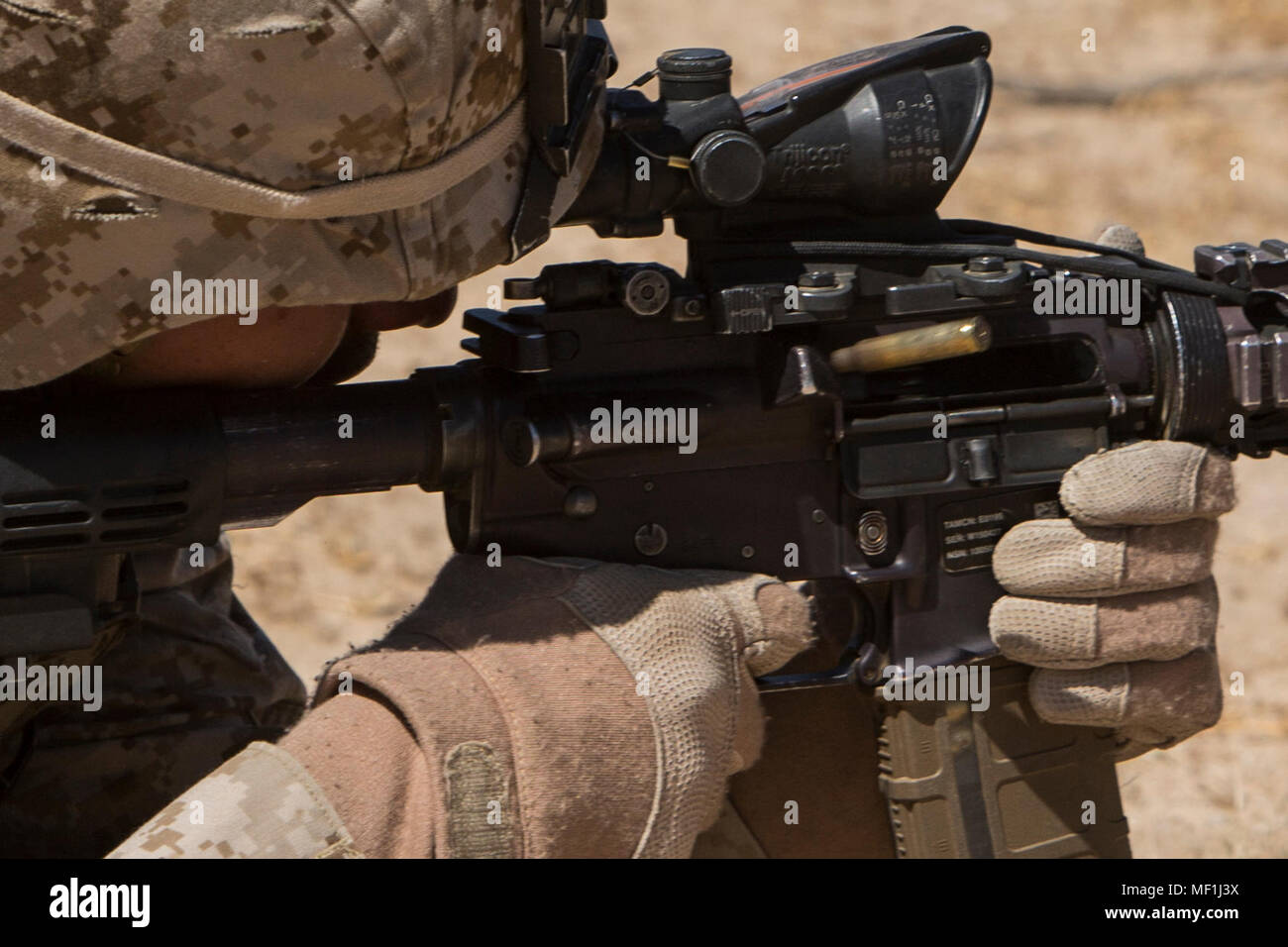 A U.S. Marine with India Company, 3rd Battalion, 2nd Marine Regiment, 2nd Marine Division, sends rounds down range during Integrated Training Exercise (ITX) 3-18 aboard the Marine Corps Air Ground Combat Center, Twentynine Palms, Calif., April 18, 2018. The purpose of ITX 3-18 is to create a challenging, realistic training environment that produces combat-ready forces capable of operating as an integrated Marine Air Ground Task Force. (U.S. Marine Corps photo by Pfc. Nathaniel Q. Hamilton) Stock Photo