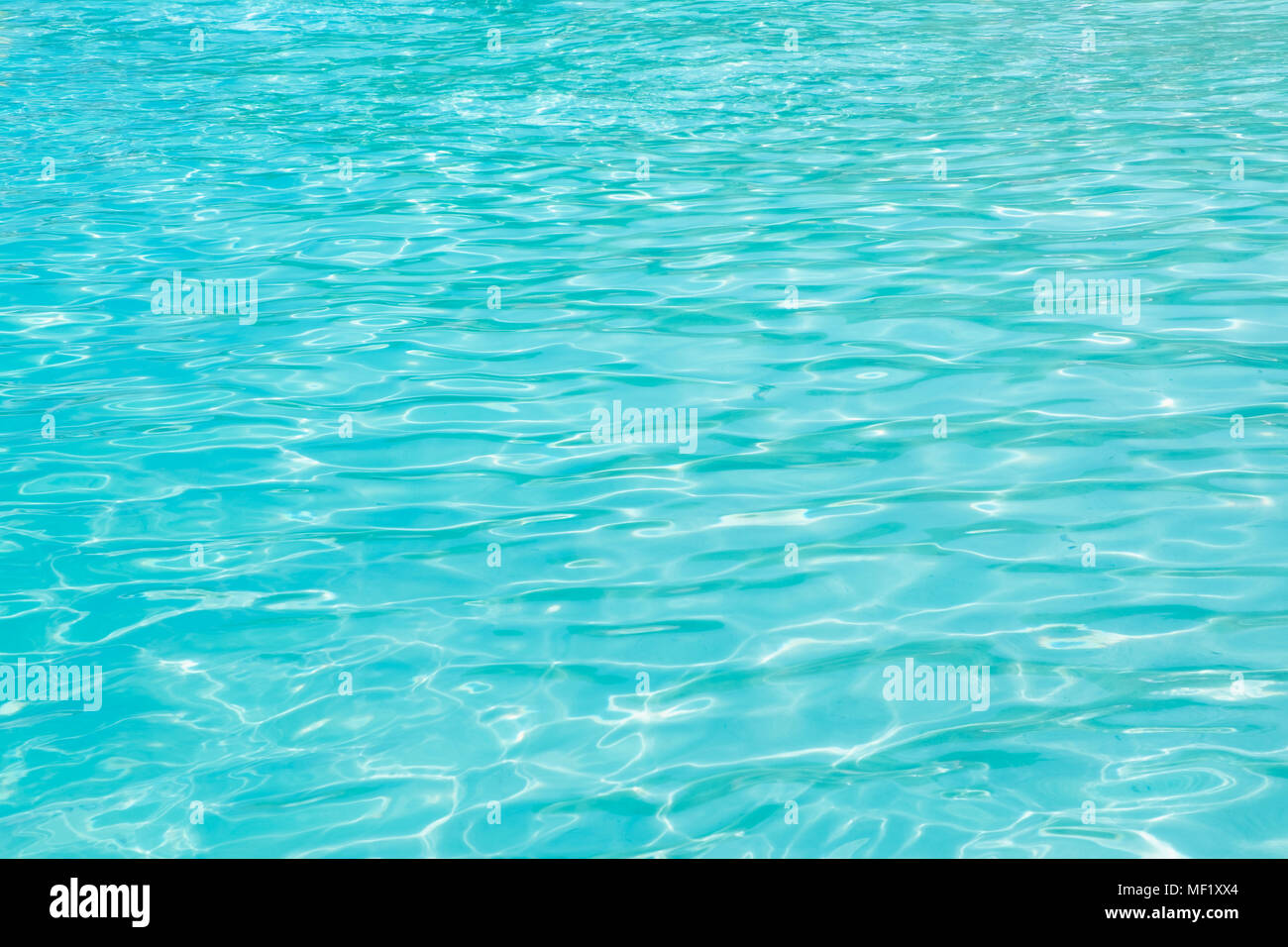 Close up wave at clear turquoise blue sea near shore,Summer Texture background. Stock Photo