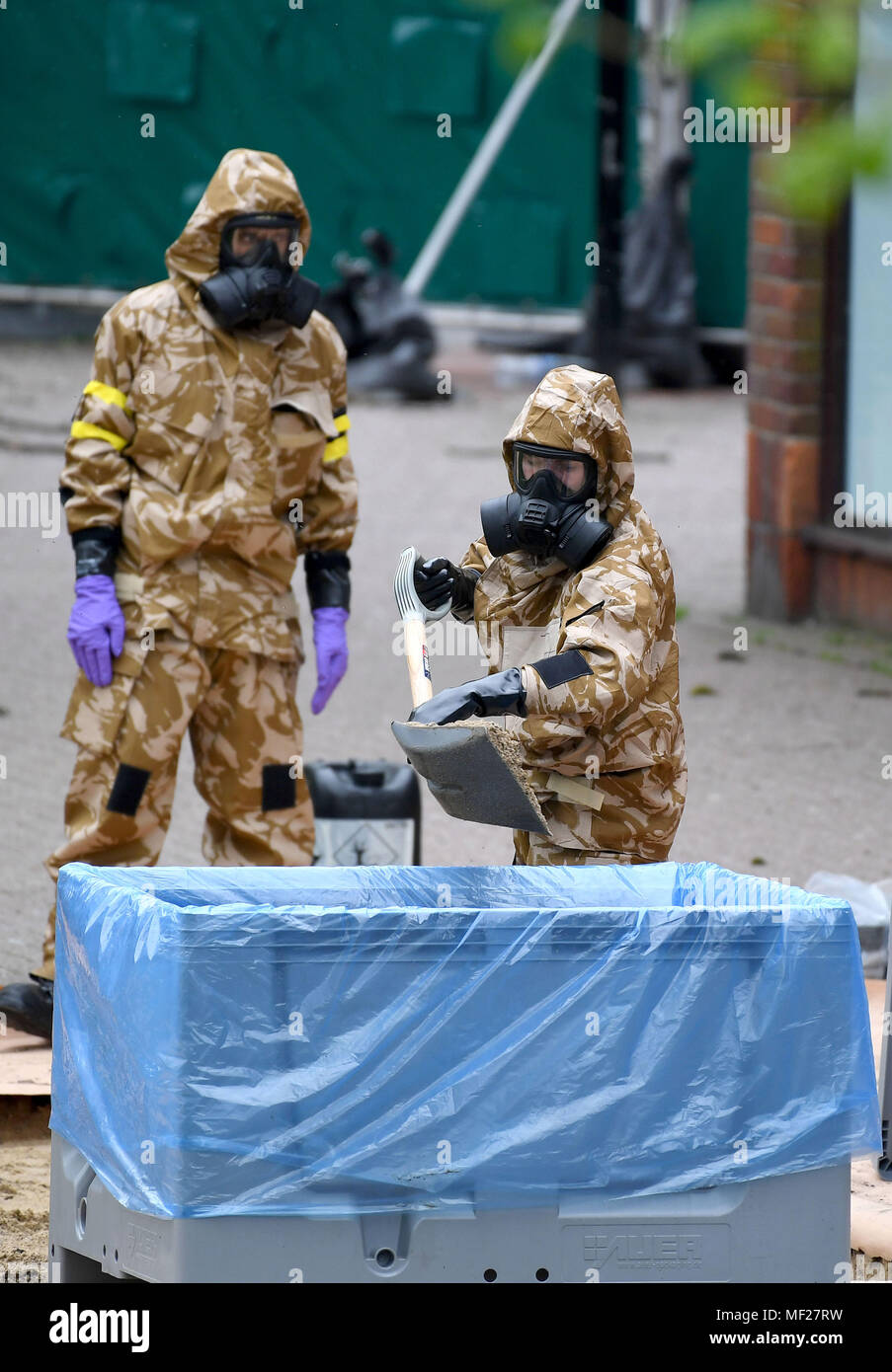 Salisbury, Wiltshire, UK. 24th April, 2018. Soldiers in breathing apparatus replacing the paving where Russian spy Sergei Skripal and his daughter collapsed after their nerve agent attack. Credit: Finnbarr Webster/Alamy Live News Stock Photo