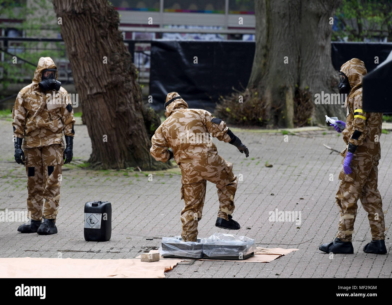 Salisbury, Wiltshire, UK. 24th Apr, 2018. Soldiers in breathing apparatus replacing the paving where Russian spy Sergei Skripal and his daughter collapsed after their nerve agent attack. Credit: Finnbarr Webster/Alamy Live News Stock Photo