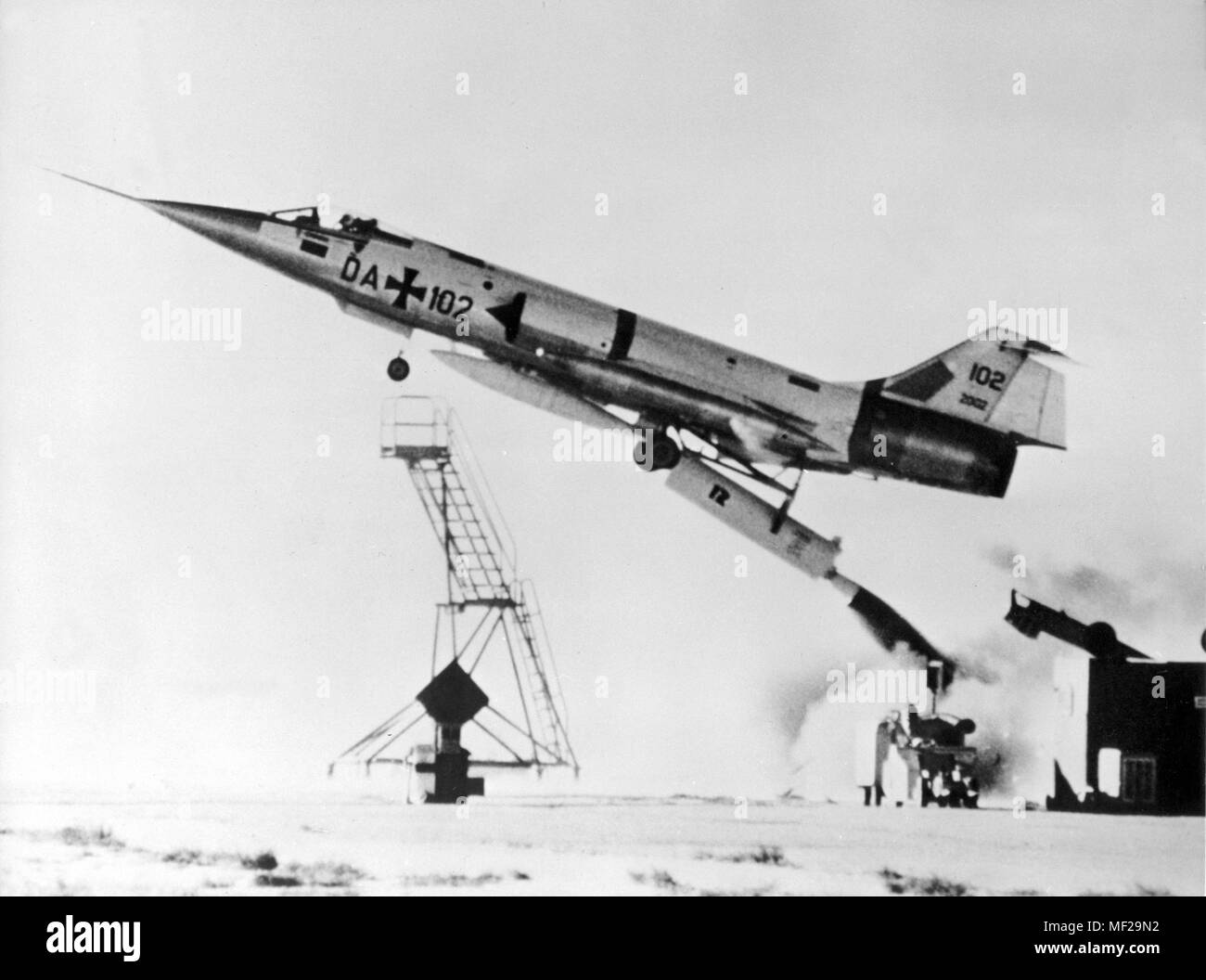 The so-called zero-start of a German Starfighter of the type F 104 G with the American test pilot Ed Brown on 18.05.1966 on the air base in the Bavarian Lagerlechfeld. On 18.05.1966 a Starfighter zero start of the German press was shown in Lagerlechfeld for the first time. Test pilot was Ed Brown, who was already used in the USA for the zero-start trials. Through a rocket drive set below the fuselage, the Starfighter is fired into the air at a steep angle, where it first fires its own rocket engine. Photo: Jurgen Diener     (c) dpa - Report     | usage worldwide Stock Photo