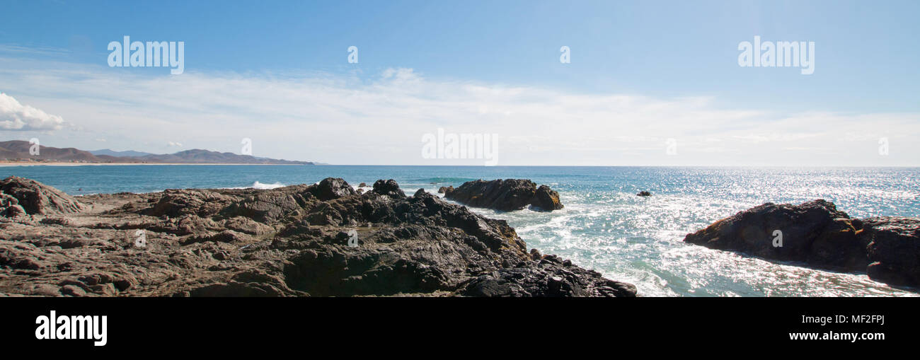 Waves breaking at rocky surfing point break at Cerritos Beach between Todos Santos and Cabo San